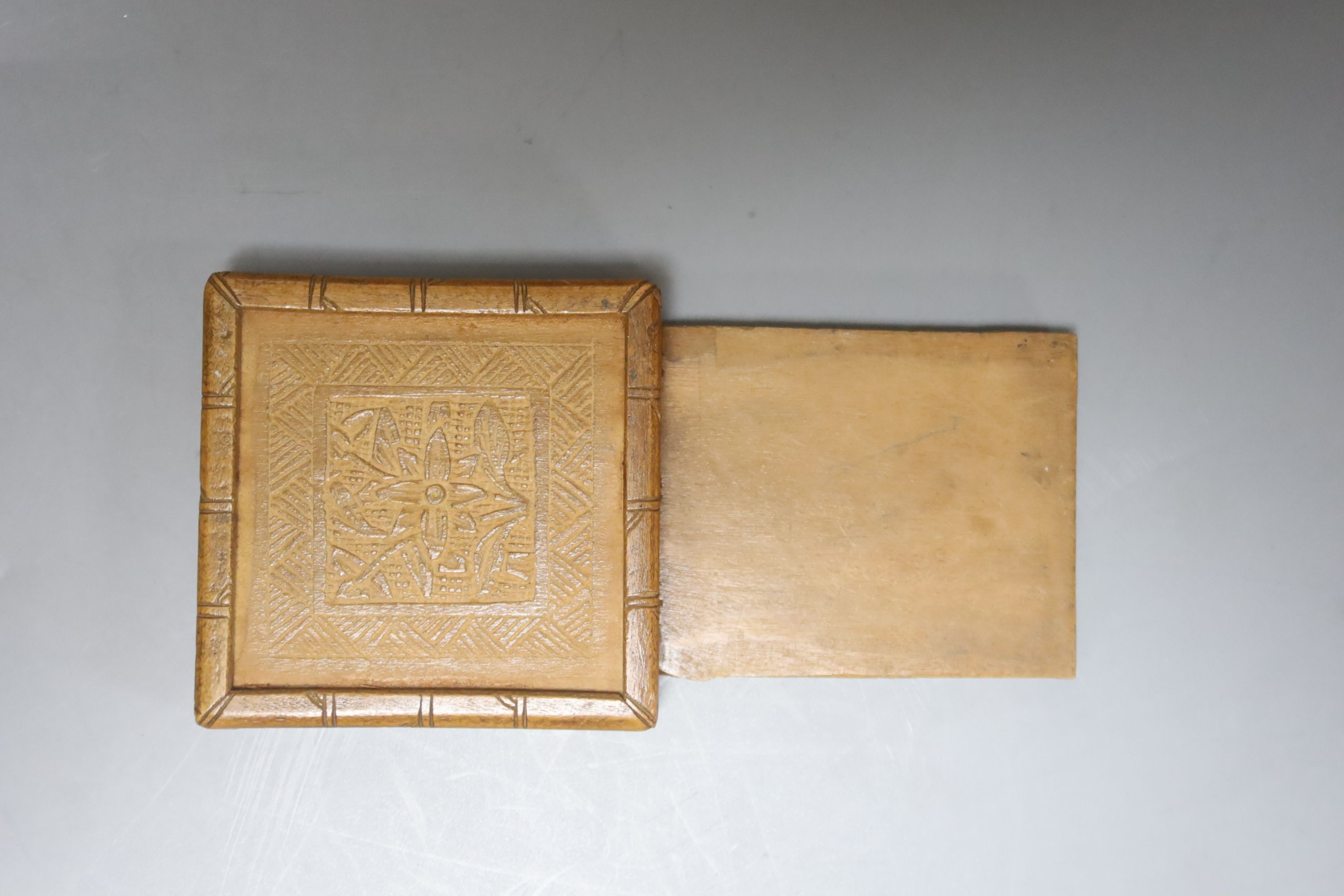 Two 19th century Chinese carved sandalwood boxes, together with a similar puzzle box, length 27cm